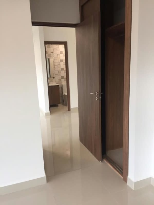 Bedroom featuring access to modern ensuite bathroom with decorative tiles Downtown Panama