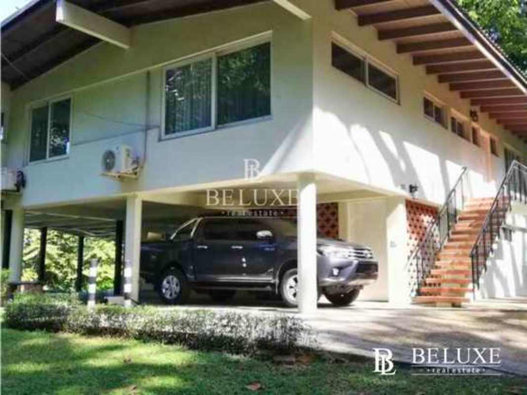 Furnished bedroom with large windows, AC, garden views in house for rent in Ancon Panama