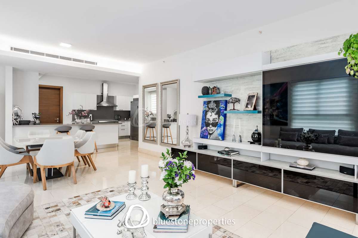 Open kitchen with island, granite countertops, stainless appliances in Santa Maria Golf Condo