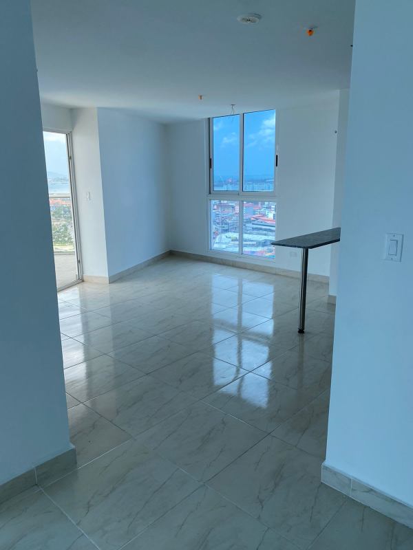 Modern open layout living dining space with balcony access and views at PH The Sands Panama City