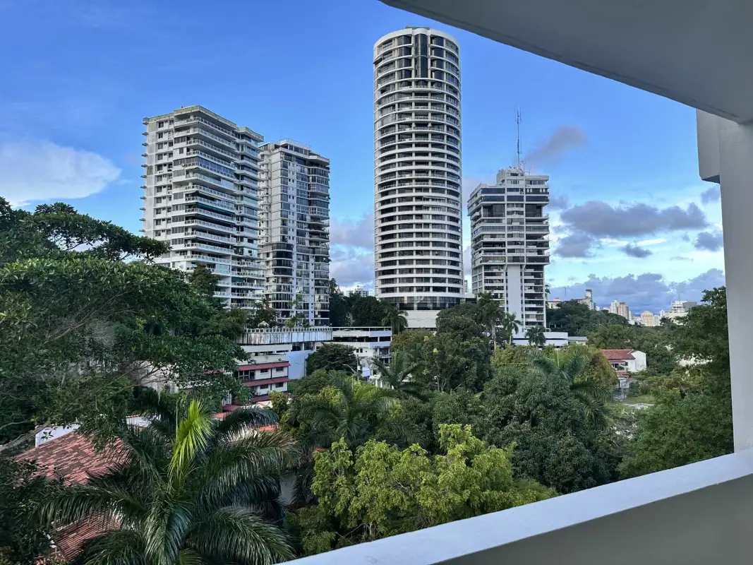Bedroom with built-in closet, tile floor and large window at PH Bella Vista Gardens Panama City