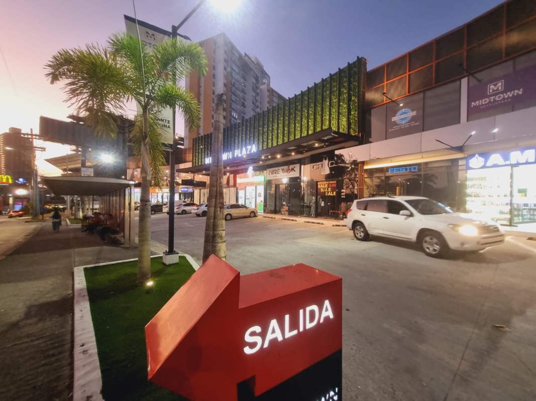 Commercial retail space interior with metal stairs, glass entry, open loft design City Plaza Panama