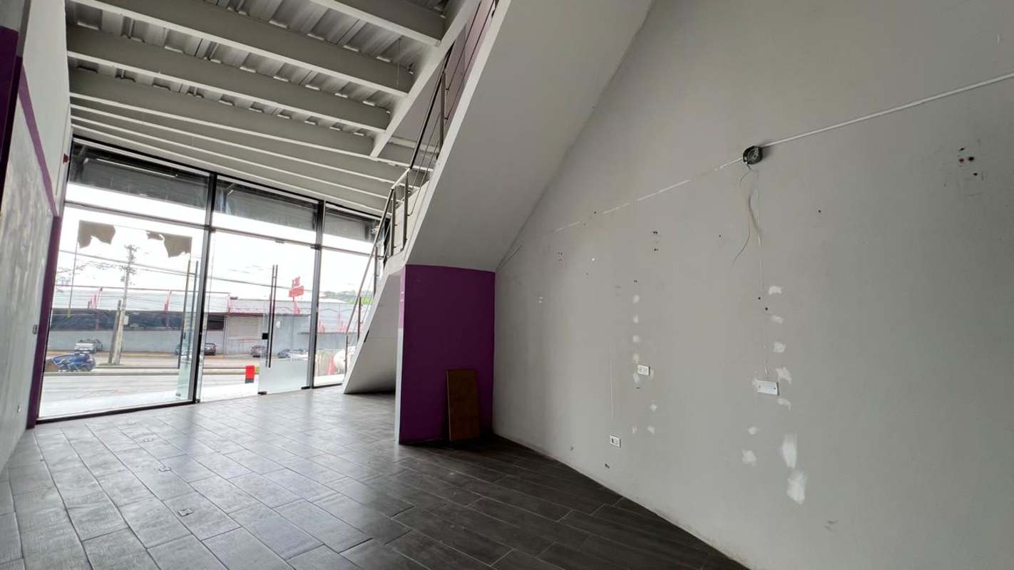 Empty commercial space with floor-to-ceiling windows metal stairs in City Plaza Tumba Muerto Panama