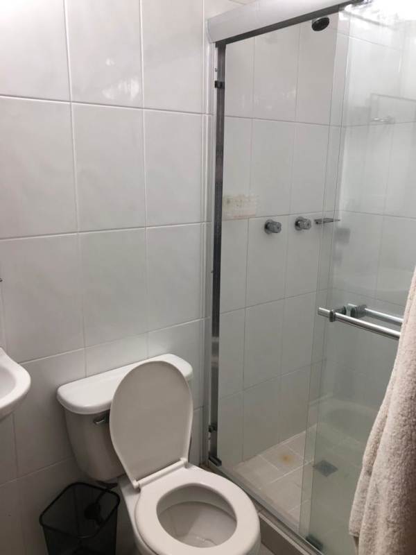 Contemporary bathroom with glass door shower, vanity and mirror in PH Pacific Hills Elite 500