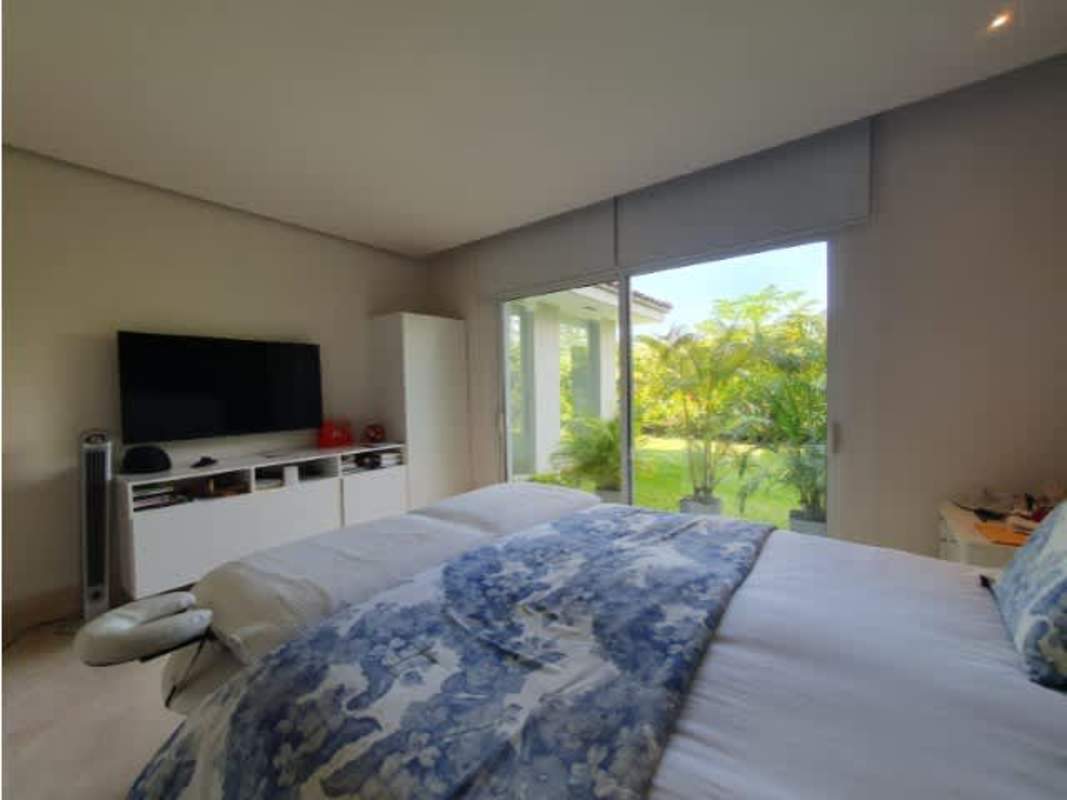 Outdoor covered terrace overlooking lush private garden at The Reserve Panama