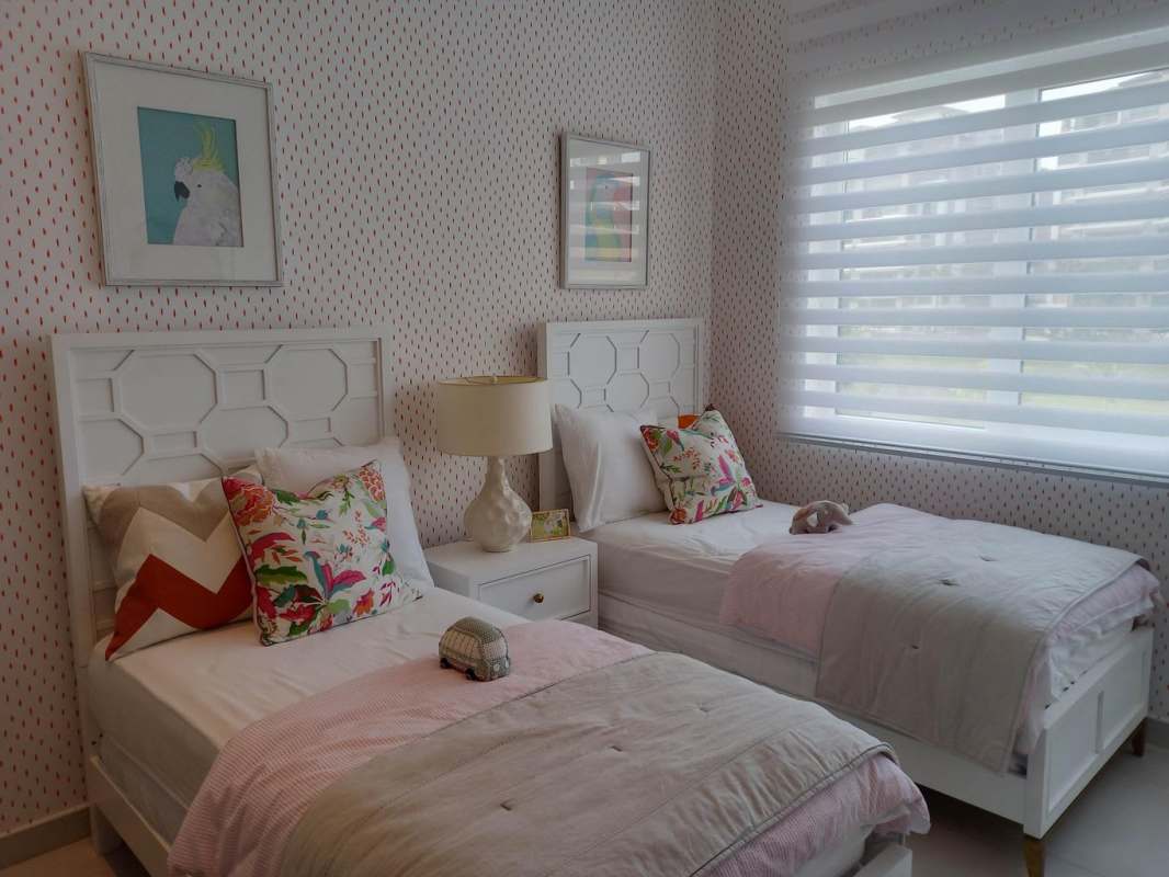 Two-story townhouse with carport landscaped front garden Santa Maria Panama