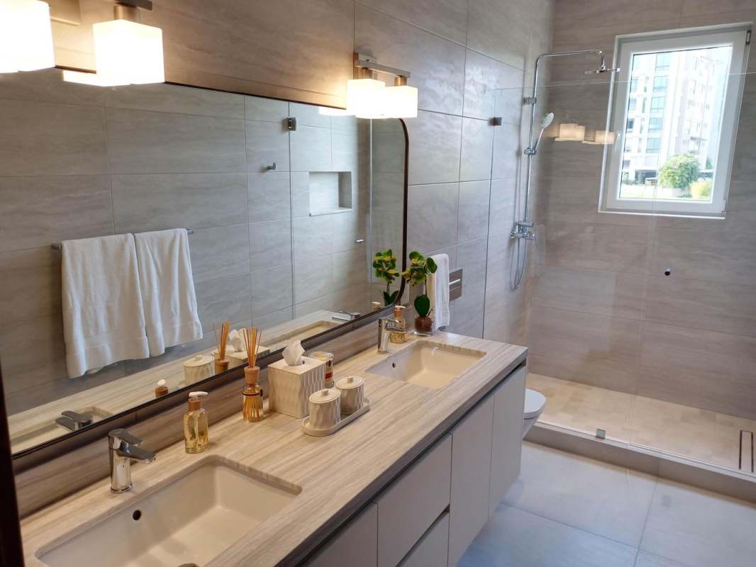 Contemporary bathroom glass enclosure marble vanity The Woods Panama