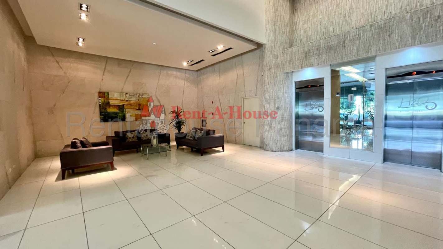 Modern living room with panoramic windows and Pacific ocean vistas in H2O Panama