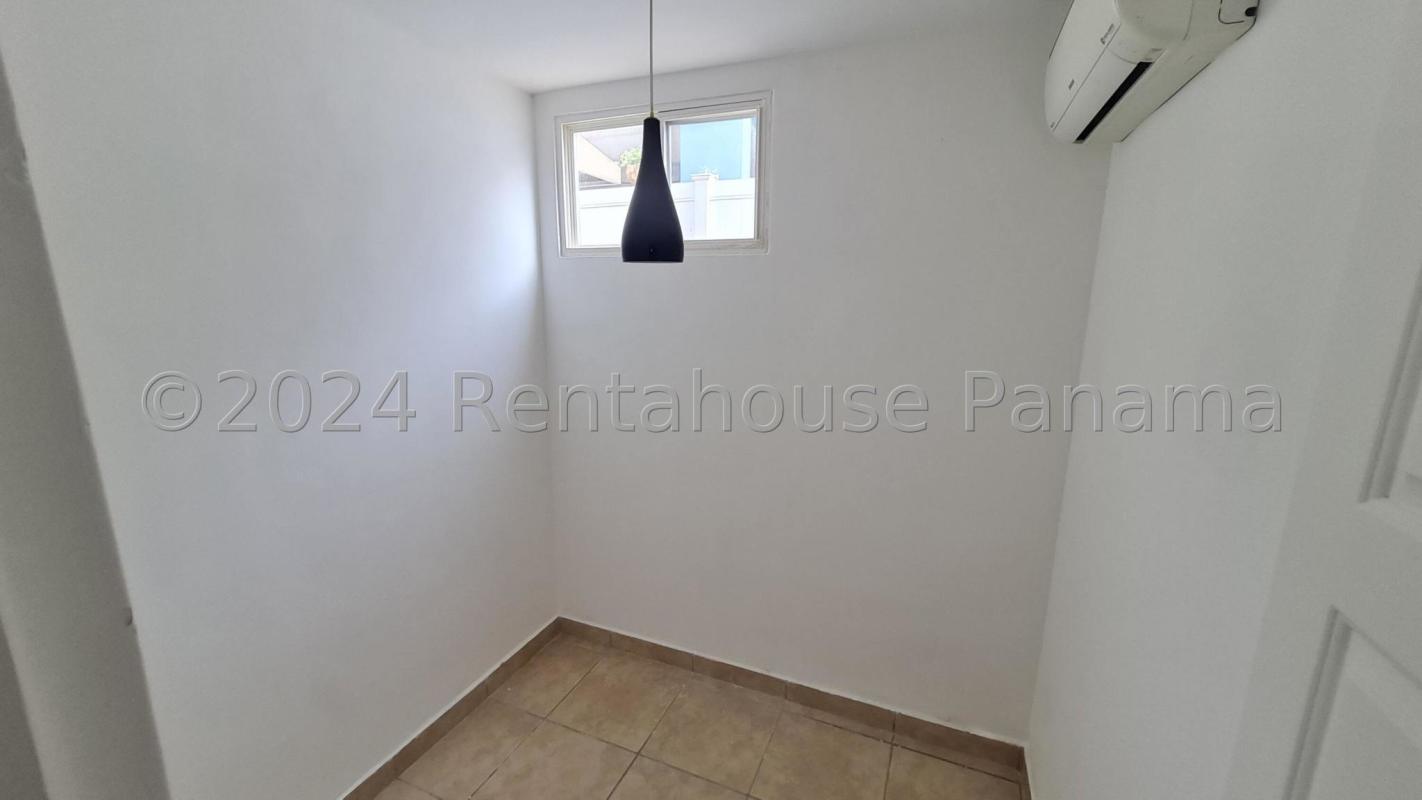 Bright bedroom with AC unit and ceramic tile floor in house for sale Brisas del Golf