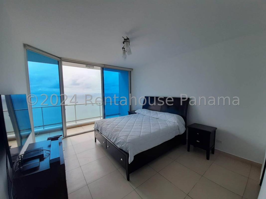 Master bedroom in Destiny Tower with large windows featuring Pacific Ocean and skyline views