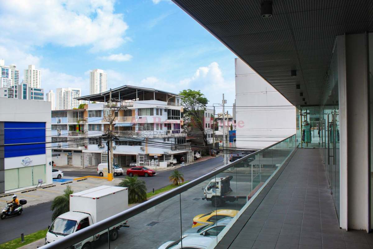 Urban commercial retail plaza with parking and street traffic Panama City Panama