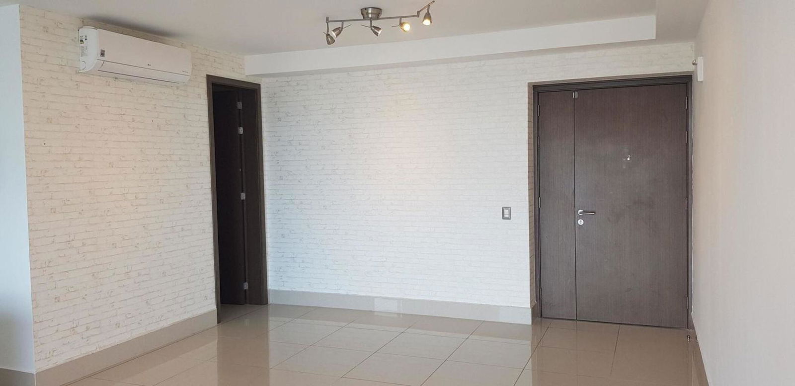 Modern kitchen with granite countertops, built-in appliances and white minimalist design in PH Bali Costa del Este Panama