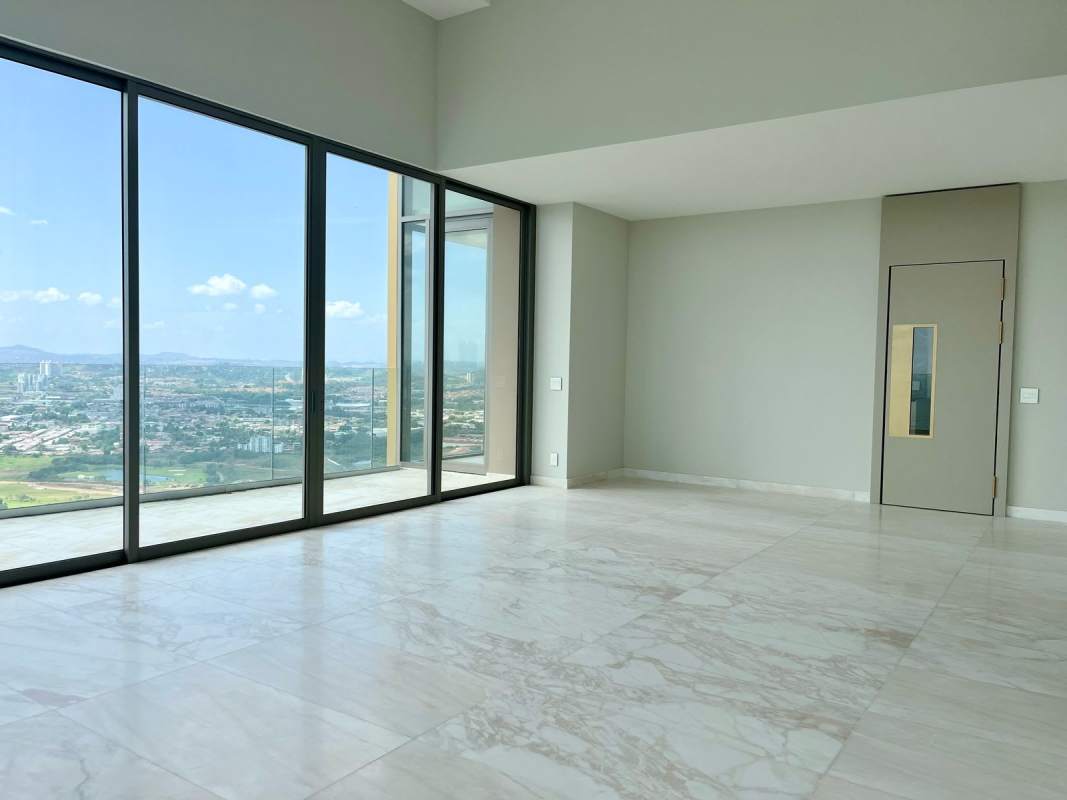 Luxury living area with marble floors, panoramic golf views, and floor-to-ceiling windows in Santa María Panama