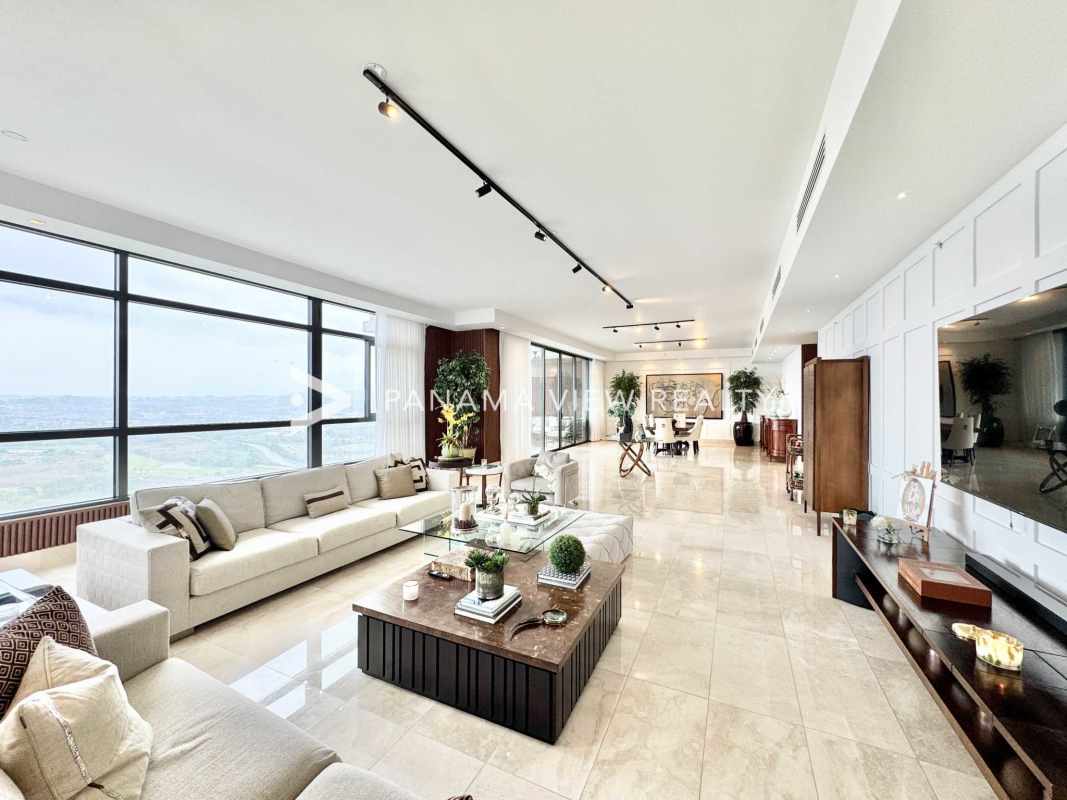 Open-plan marble floor luxury living dining room in PH Albatross Santa Maria with ceiling windows and panoramic views