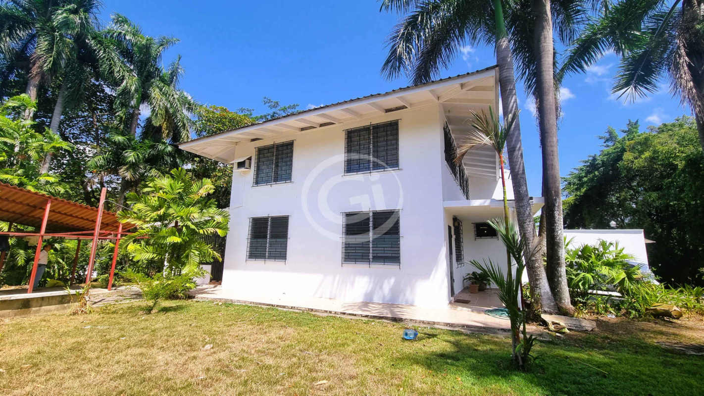 Bright living area with large windows and tiled floors in house for sale Diablo Heights Panama