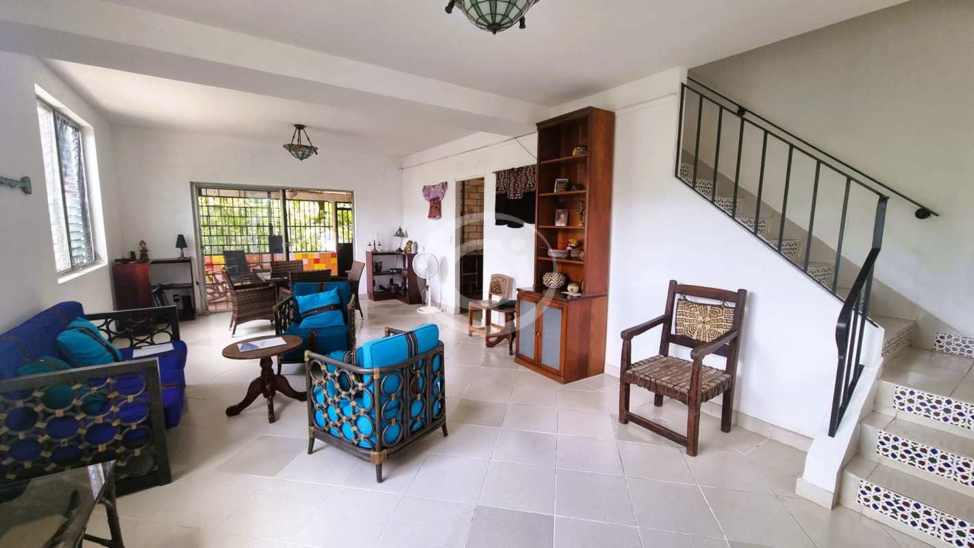 Kitchen with window, wooden cabinets and ample storage in Diablo Heights Panama house