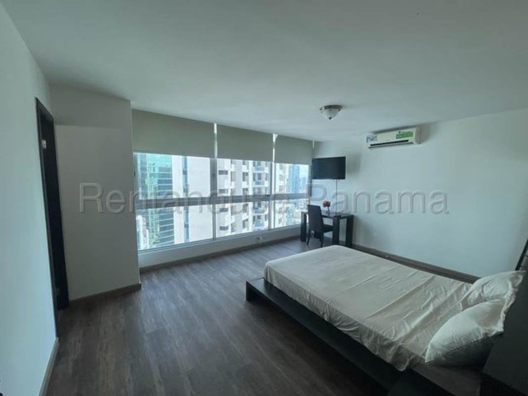 Sky terrace on rooftop with dining tables, barbecue grills, skyline and ocean views Bayfront Panama