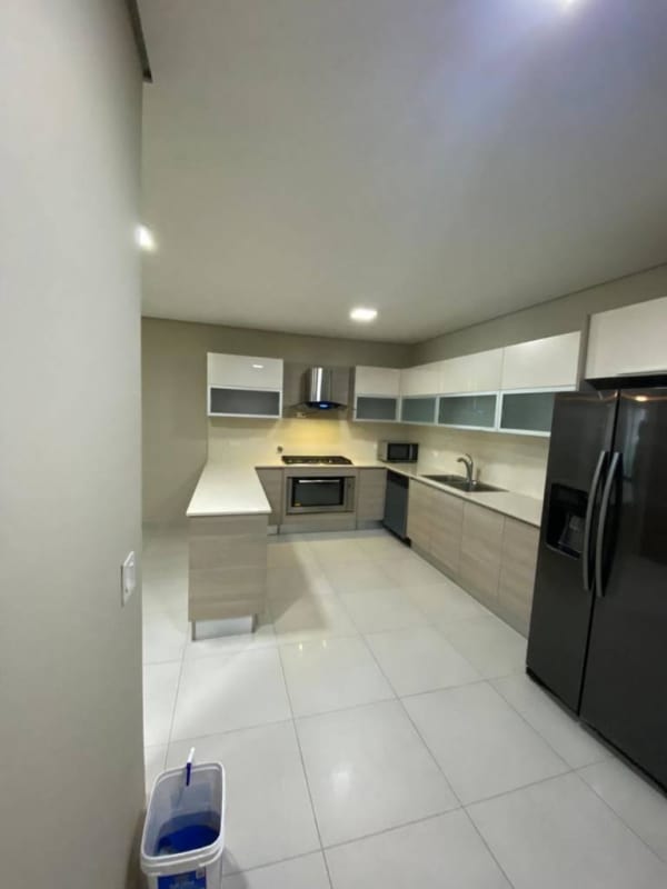 Modern double-height open living and dining room with ocean views PH Mirador Panama City