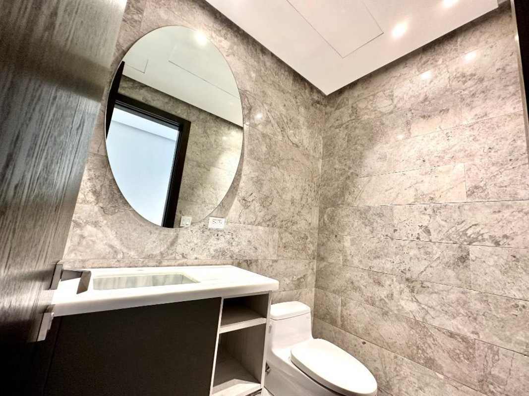 Spacious terrace with panoramic city views and outdoor lounge furniture PH Punta Paitilla Panama