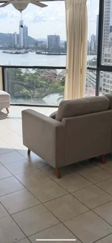 Panoramic city skyline water views from furnished living room PH Bayside Punta Paitilla