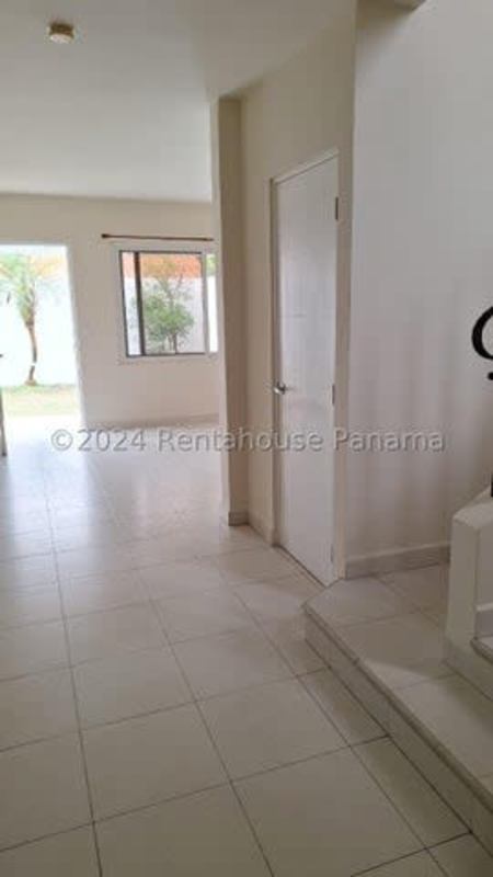 Mediterranean-style two-story home with red tile roof and carport in Quintas de Versalles II Panama