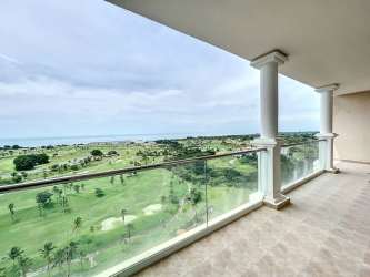 Modern living dining room with panoramic ocean golf views in luxury Panama condo