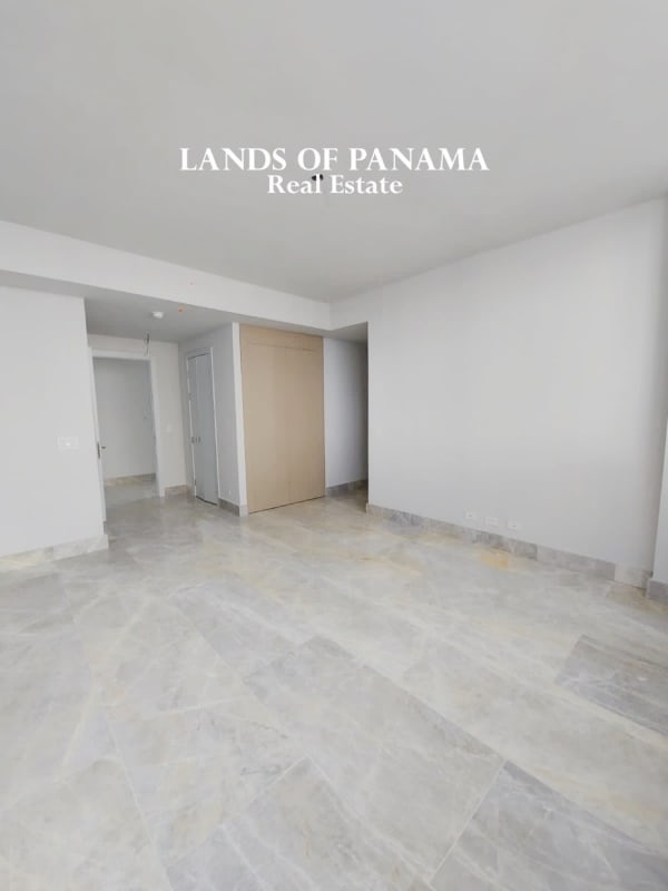 Minimalist kitchen featuring marble island and cabinetry in PH The Towers Punta Paitilla luxury condo