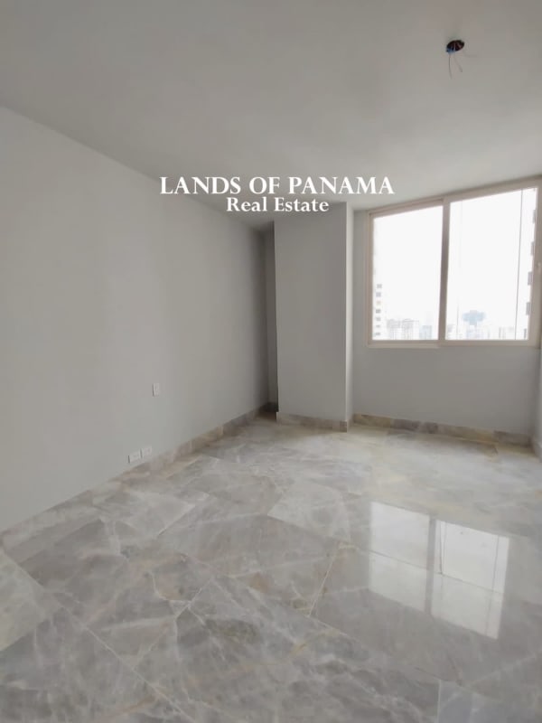 Bright master bedroom in PH The Towers Punta Paitilla with marble floors and ocean view window