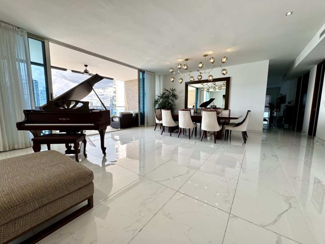 Spacious kitchen with wood cabinets, granite countertop and large windows with city view at PH Aqualina Punta Pacifica