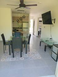 Open concept living dining space fully furnished in house Residencial Papiro Nueva Gorgona Panama