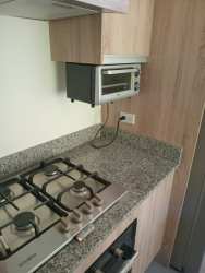 Modern kitchen granite countertops new appliances Residencial Papiro Nueva Gorgona