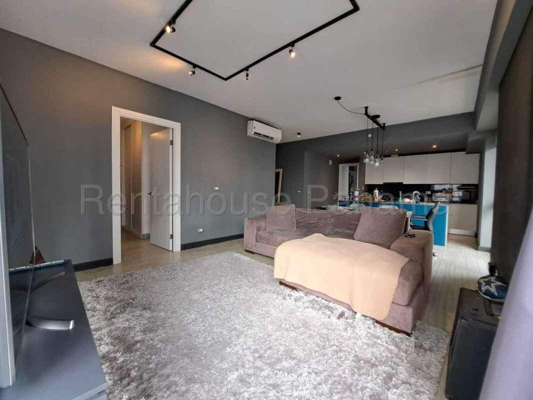 Open living dining space with balcony and city skyline view in PH Midtown Panama