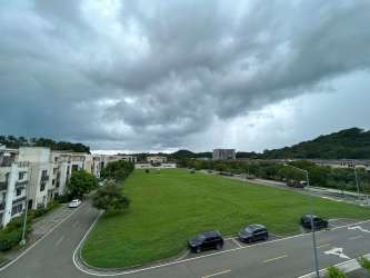 Open plan living and dining with access to balcony at PH River Valley Panama Pacifico