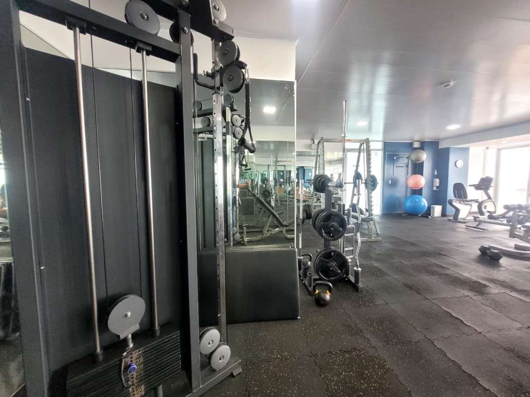 Modern fitness center with weight machines and cardio equipment PH Terramar San Francisco Panama