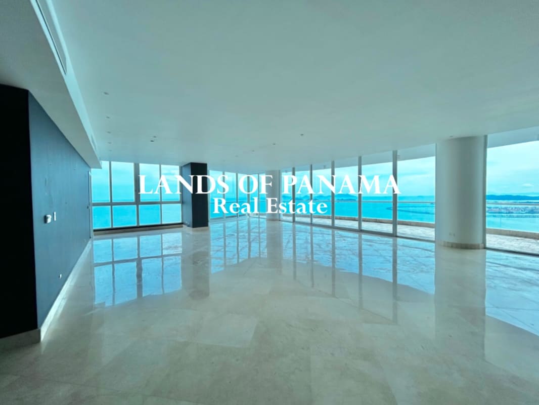 Contemporary kitchen with granite countertops, island, wood cabinetry, stainless appliances in PH The Point Punta Paitilla Panama