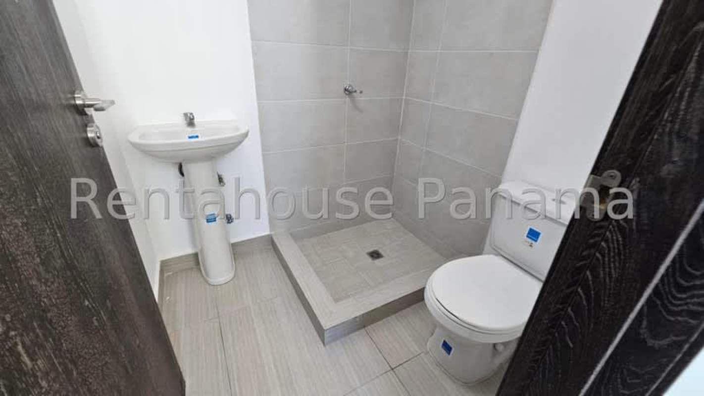 Modern bathroom with glass shower enclosure and vanity PH Oceana Panama