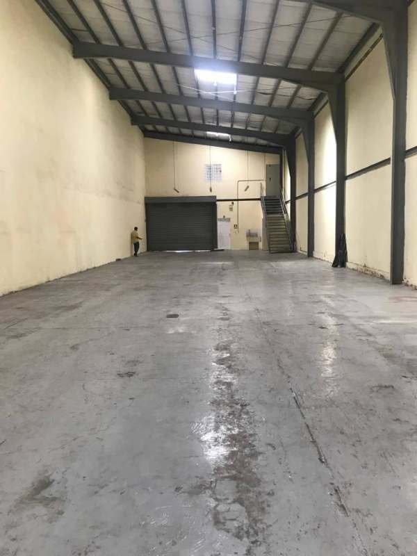 Interior warehouse with mezzanine office platform high ceiling Lefevre Business Center