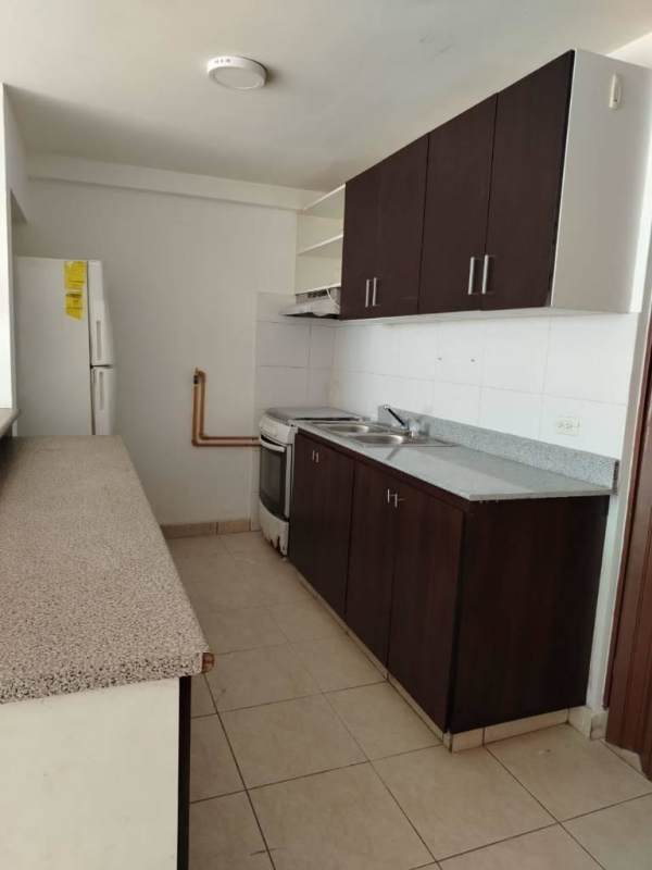 Minimalist bathroom with tiled walls, walk-in shower, pedestal sink PH Central Park Panama