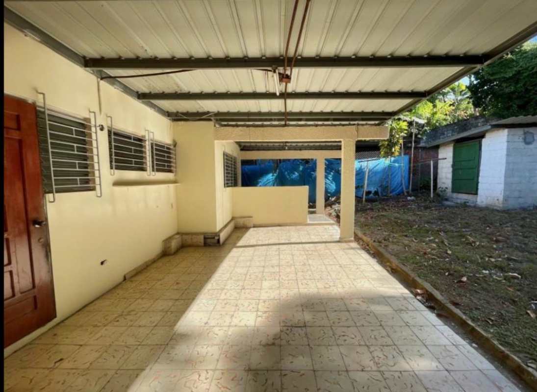 Covered patio with tile floor laundry area backyard house for sale Villa de las Fuentes Panama