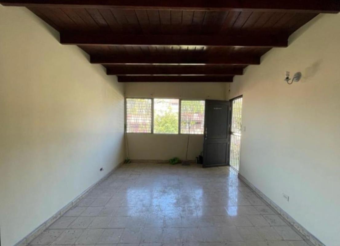 Living room with exposed wooden beams ceiling light tile floors house sale Panama