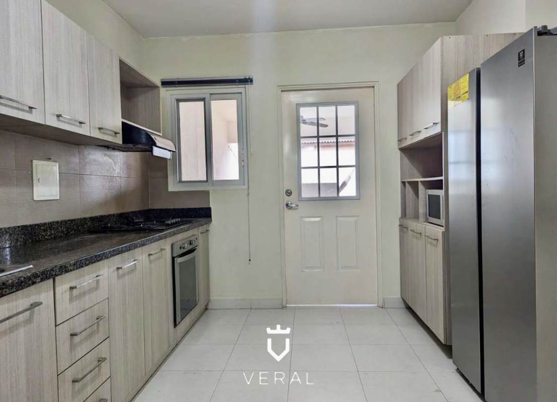 Bright living dining area with marble floor and large windows in duplex house Costa Sur Panama