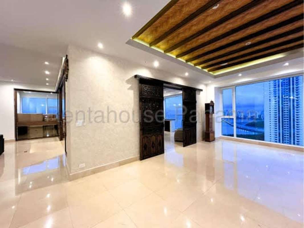 Spacious modern living room with panoramic city skyline and ocean views PH Marea II Costa del Este