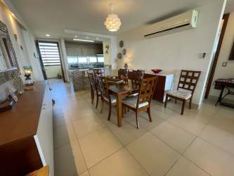 Bedroom with ocean view window and balcony access PH Bahia Playa Gorgona Panama