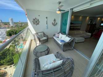 Bright living space with patio doors to oceanfront balcony PH Bahia Playa Gorgona Panama