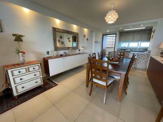 Modern kitchen with granite countertops, wood cabinetry in PH Bahia Playa Gorgona Panama