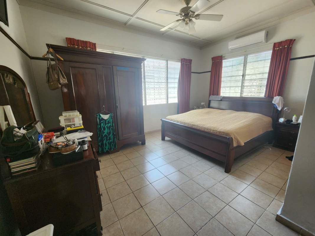 Bright bedroom workspace tile floors window Coco del Mar commercial house Panama City