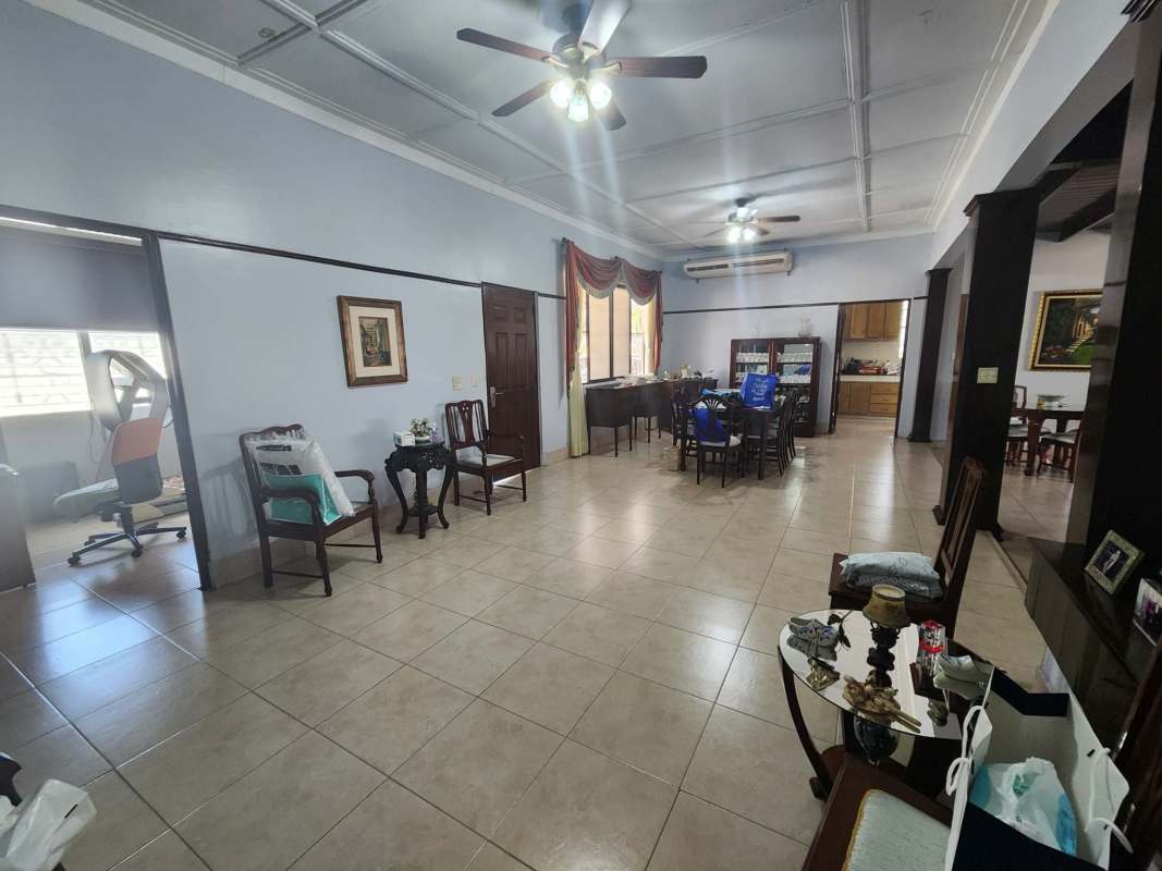 Large open reception hall with tile floors traditional design office house Coco del Mar Panama City