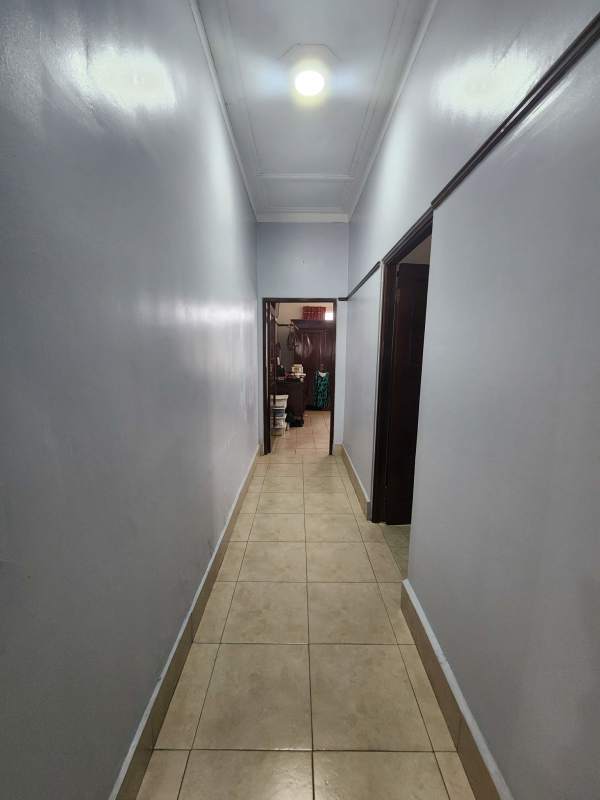 Office room with large windows tiled floor ceiling fan at Coco del Mar office house Panama City