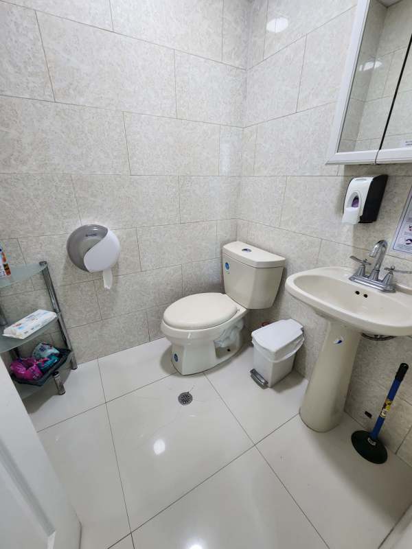 Tiled bathroom with pedestal sink modern fixtures Oceania Punta Pacifica Panama