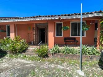 Rustic bedroom with exposed beams AC tile floor windows San Carlos Panama